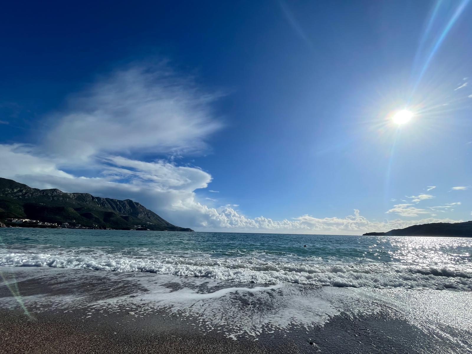 Sunny beach with waves